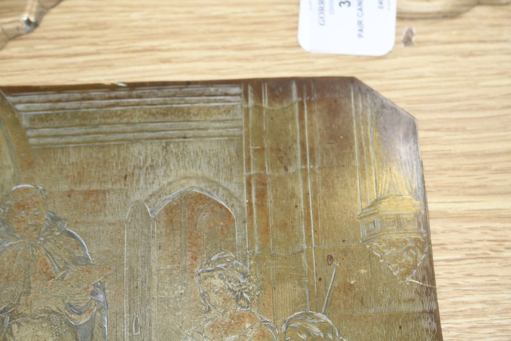A 19th century engraved copper printing plate, probably later gilded, depicting figures around a stag